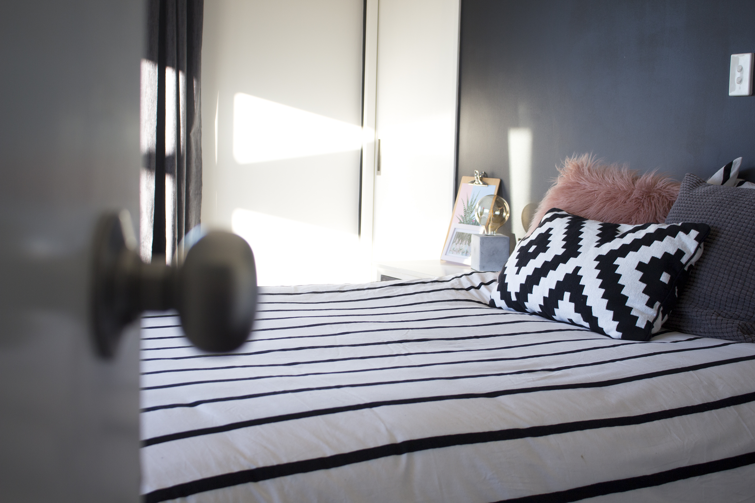 Need some master bedroom inspo? Take a look at our fresh, new, scandi bedroom with a black feature wall!