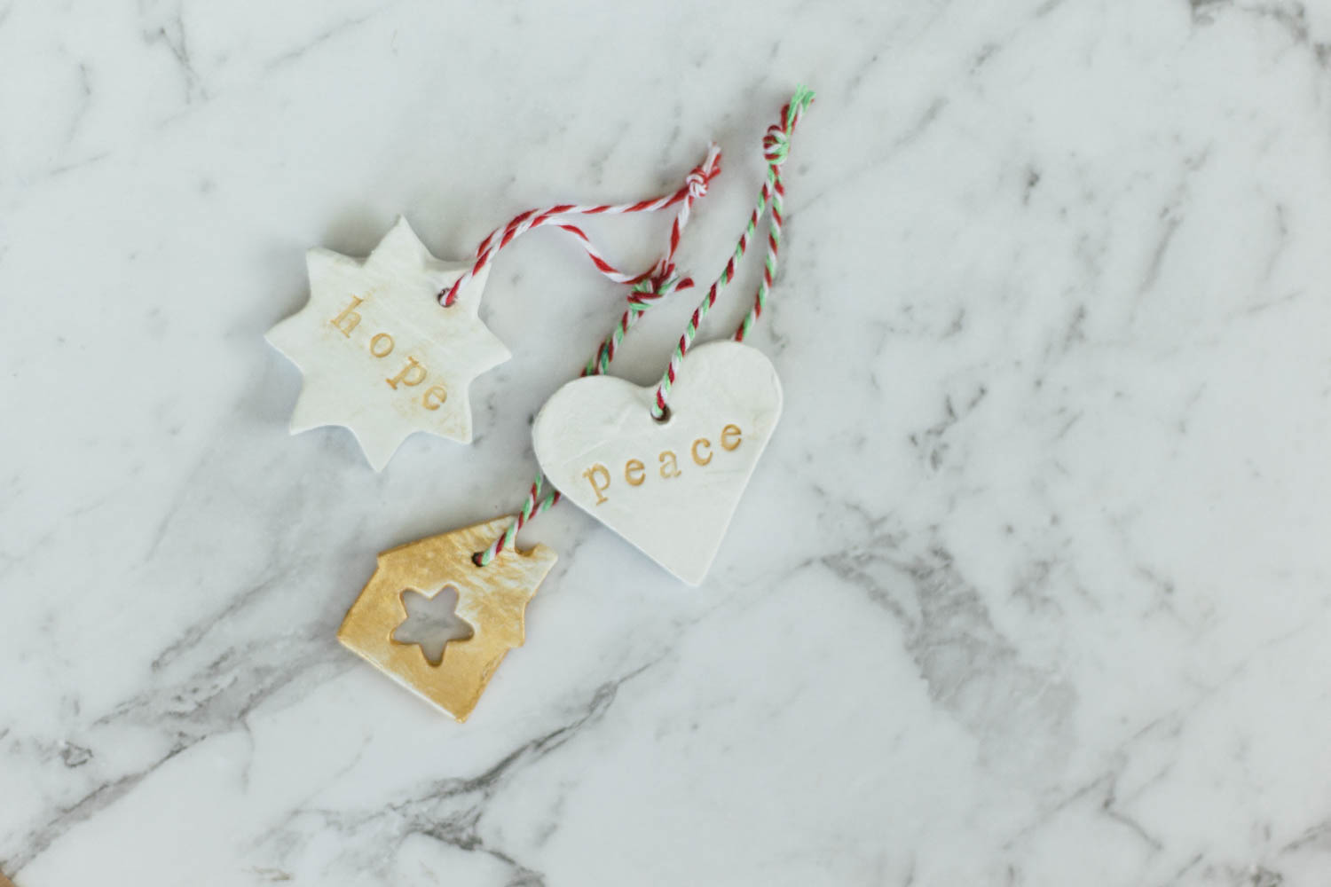 Hand-stamped clay tree decorations for Christmas